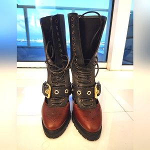 Burberry platform lug sole lace up boot; red snake and peekaboo detail. Size 40